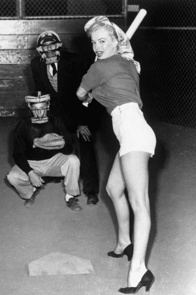00 Marilyn Monroe prepares to swing during a baseball game at 20th Century Fox Studio - 1952.png