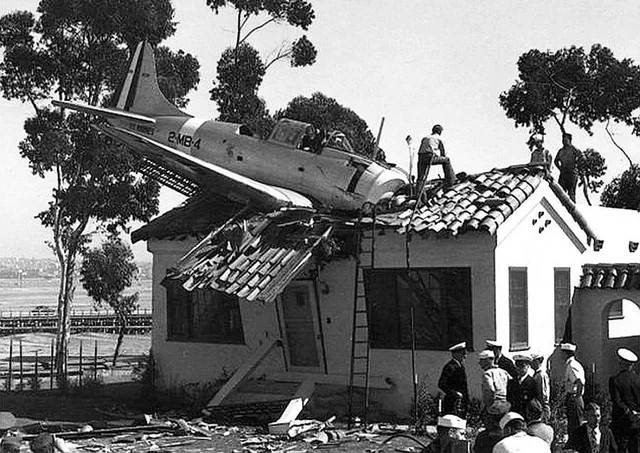 0000000000 A Douglas SBD Dauntless of Marine squadron VMB-2 has an encounter with a house at R...jpg