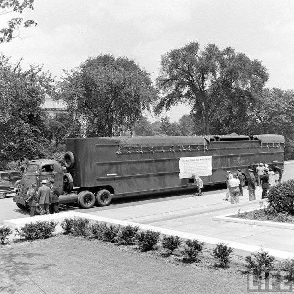 000000m Twin engine Ford with 60-foot-long supertrailer made to haul wings for B-24 bombers du...jpg