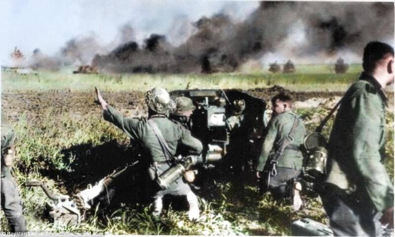 00578-4996388-German_artillerymen_shoot_at_Soviet_tanks_on_a_desolate_plain_in-a-1_1508514752492.jpg