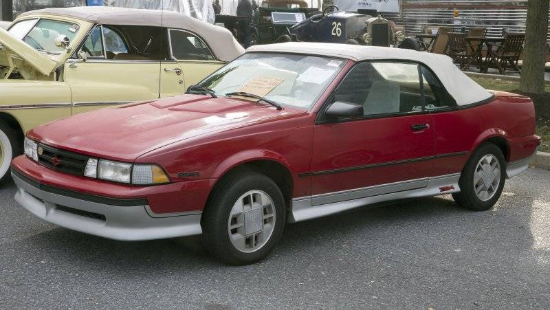 2560px-1989_Chevrolet_Cavalier_Z24_Convertible_in_Dark_Red,_front_left_(Hershey_2019).jpg