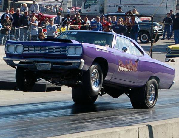 68 Roadrunner w-6bbl hood Purple Wheels up launch.jpg
