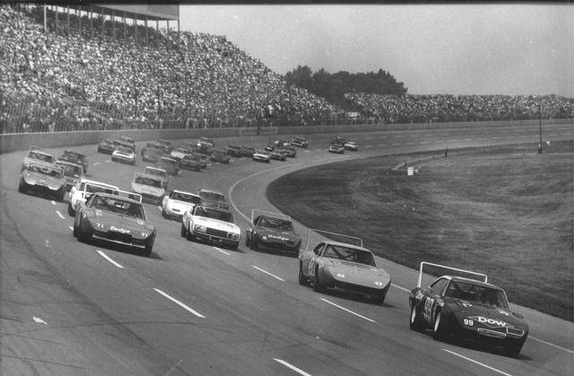 69 Daytona Charger Nascar #71 K&K Insurance on track with many Areo cars.jpg