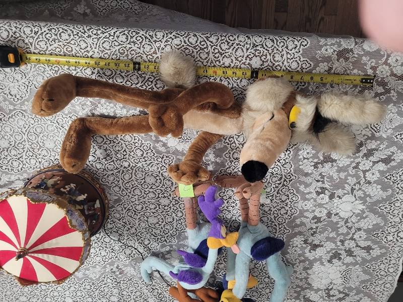 May be an image of slow loris and toy