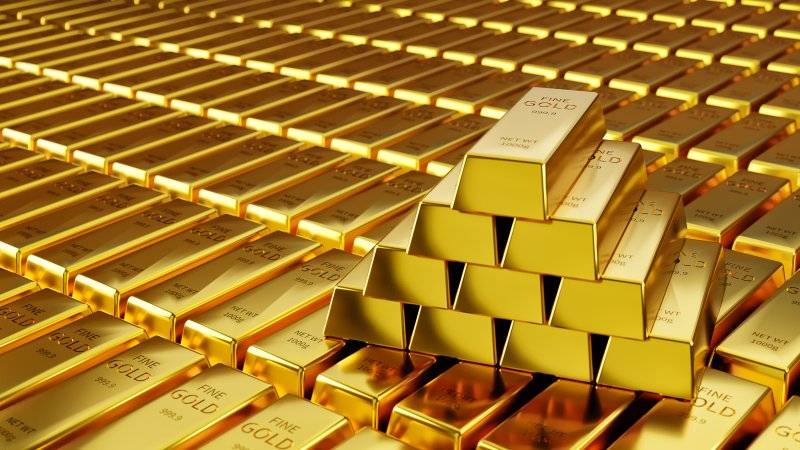 a-pyramid-of-gold-bars-sits-on-rows-of-other-gold-bars.jpg