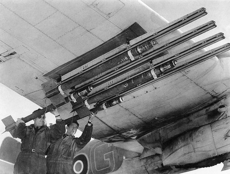 Beaufighter-MkX-RCAF-404Sqn-2G-being-fitted-with-3-inch-25lb-rockets-IWM-CH13179.jpg