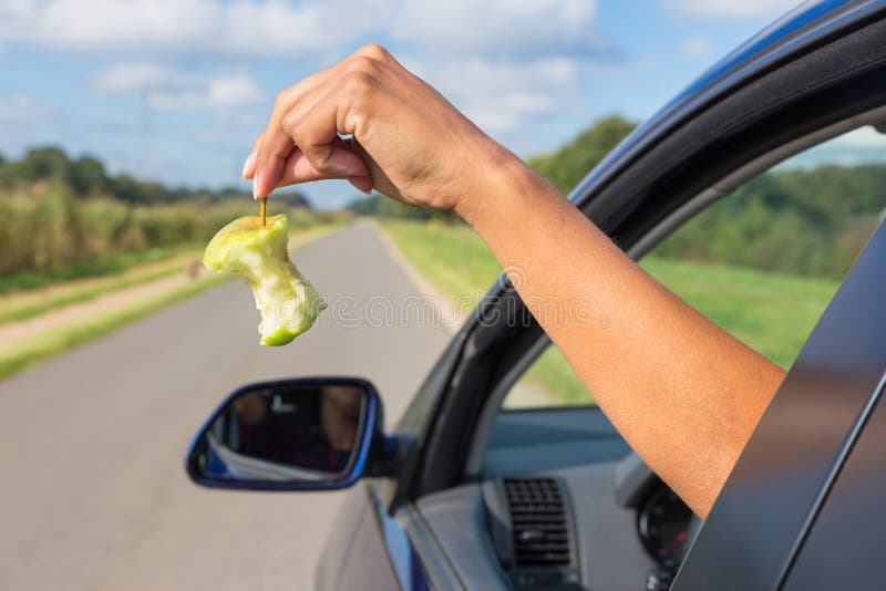 -core-out-car-window-throwing-fruit-waste-78938879.jpg