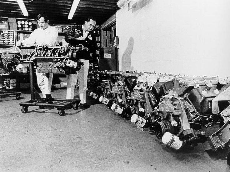 Crew Chief Harry Hyde (right) peers down a row of race HEMI's_.jpeg