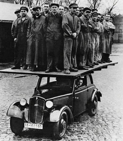 Engineers Testing the strength of a car in 1939.jpg