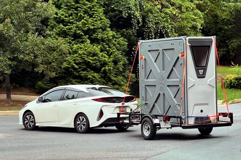 The CMAX System weighs just 330 lb (150 kg) – the same as a dirt bike. It can hence be towed behind a small car such as this Honda Prius