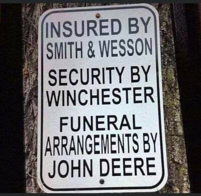 Gun sign Protectected by S&W security by Winchester funeral by John Deer.jpg