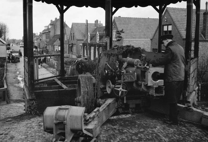 k_gun_emplaced_in_a_bandstand_at_Nieuland%2C_near_Middelburg_in_Holland%2C_November_1944._CL1519.jpg