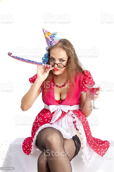 sexy-woman-with-party-horn-blower-and-birthday-hat-picture-id121314446.jpg