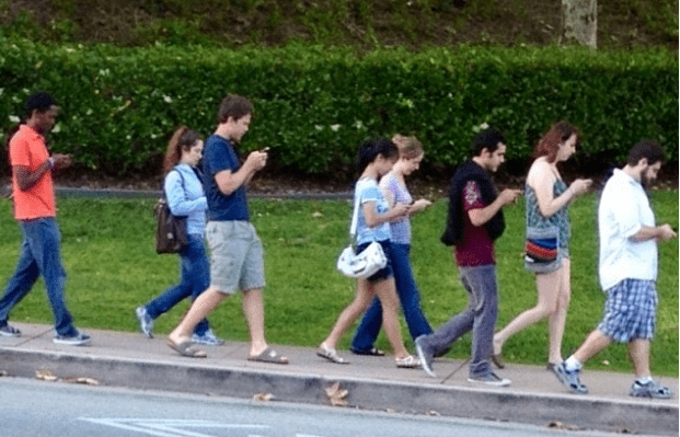 Smiley Cell Phones Stupid generation college kids.png