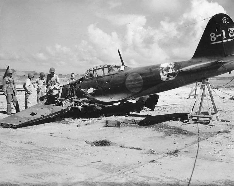 US_troops_inspect_the_wreckage_of_A6M5_Zero_8-13_on_Saipan.jpg