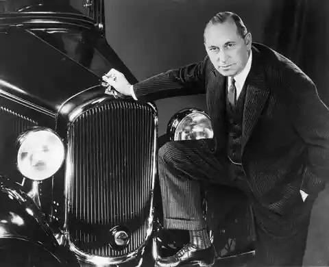 Walter P. Chrysler posing with a 1932 Plymouth.jpg