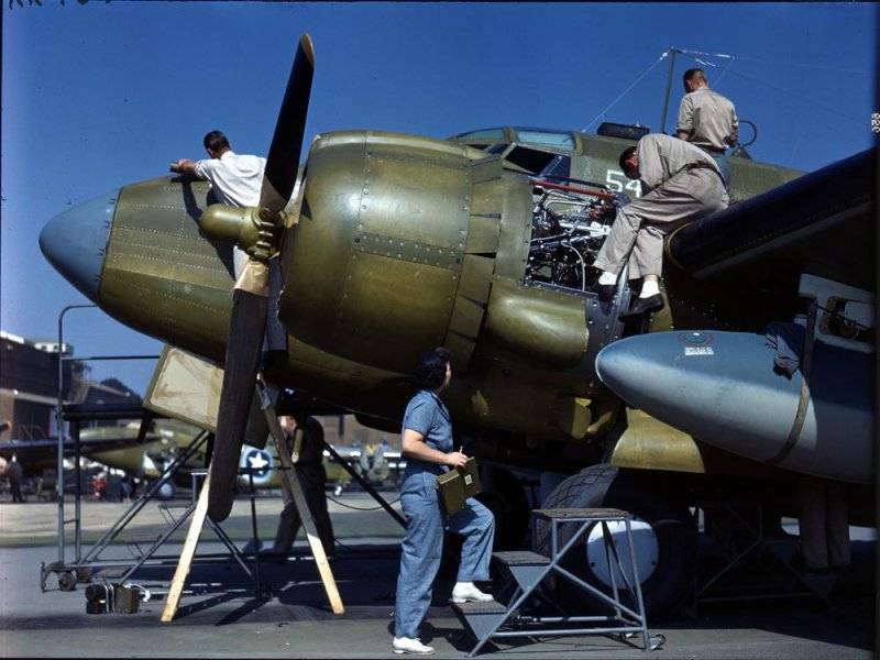 Workers at the Vega Aircraft Company, a division of Lockheed, put the finishing touches on a P...jpg