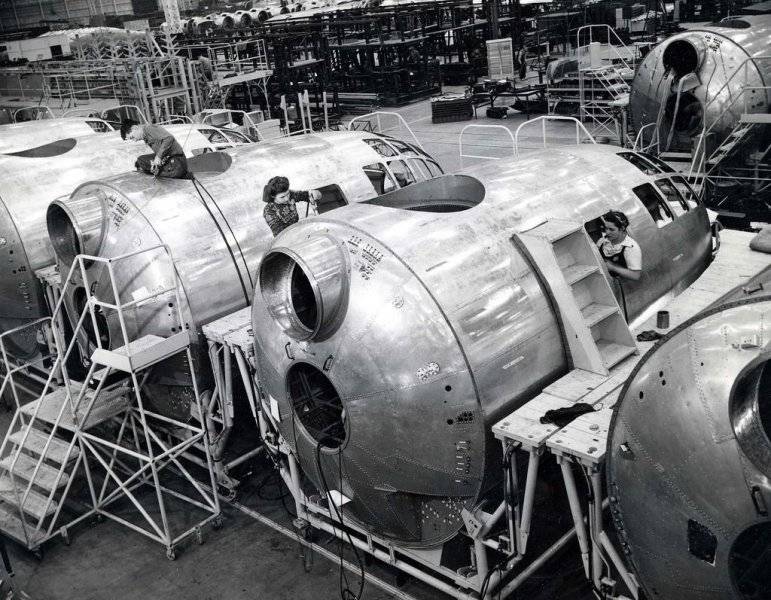 Workers on the B-29 production line constructing the forward fuselage sections. The Superfortr...jpg