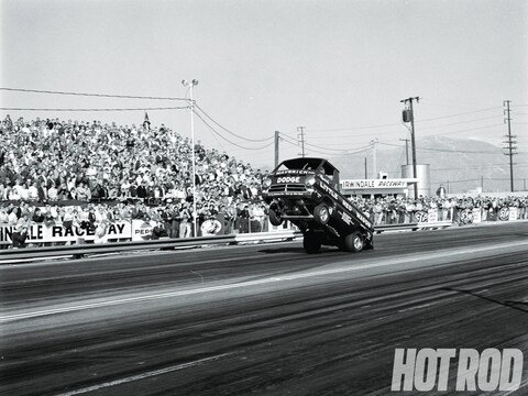 hrdp-1304-01-where-it-all-began-the-little-red-wagon-1964-dodge-a100-wheelie-angled-view.jpg