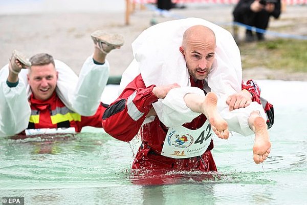 Men from across the globe drag their women through a deep water pool and sandy tracks to be crown the Wife carrying champion