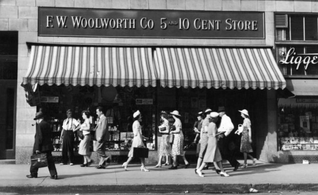 people-walk-past-an-f-w-woolworth-five-and-dime-store-on-a-news-photo-1761142-1542316091.jpg