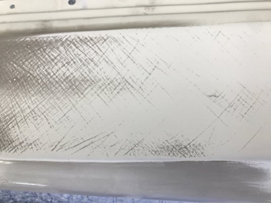 Wet Sanding Epoxy on Rear Quarter Trim.jpg