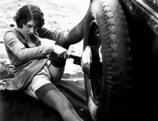 Woman Changing Tire in the 20.jpg