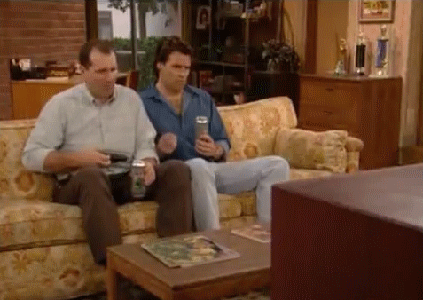 of-al-bundy-loosing-it-and-throwing-the-remote-at-the-tv-from-the-hit-show-married-with-children.gif