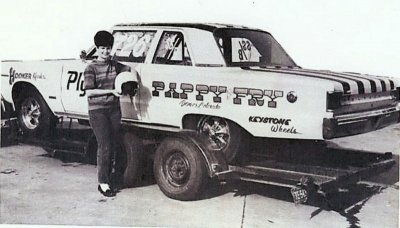 Judy Lilly standing next to 66 RO Ply on trailer.jpg