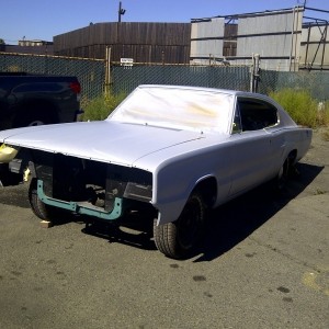 66charger at bodyshop primed.jpg