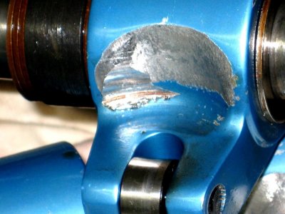 rocker arm wear from spring.JPG rocker arm wear from spring.JPG