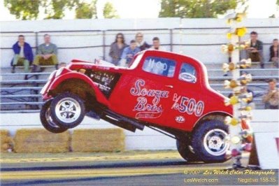 Red 33 Willys high in the air.jpg