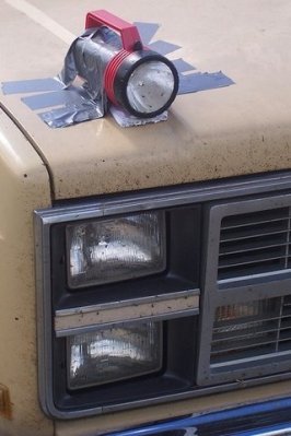 duct-tape-headlight-repair-flashlight-taped-to-hood_zps5d81d0ab.jpg