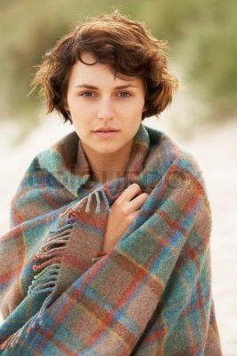 1240811-young-woman-standing-in-sand-dunes-wrapped-in-blanket.jpg