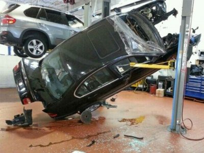 car-photo-2006-bmw-330i-falls-off-shop-lift-fail.jpg