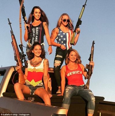 0578-4810326-Four_girls_stand_on_the_back_of_a_pick_up_truck_holding_guns_One-m-83_1503693201253.jpg