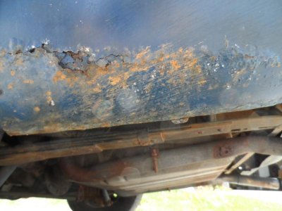 rust driver rear quarter.jpg rust driver rear quarter.jpg