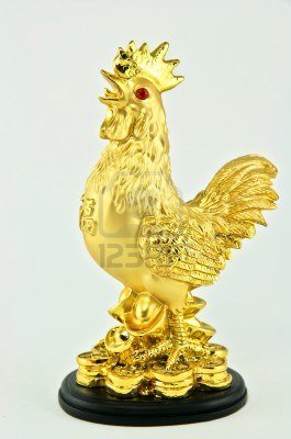 12823272-the-statue-stands-as-a-majestic-golden-chicken.jpg