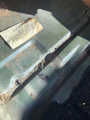 Under drivers footwell carpet with paper tag.jpg Under drivers footwell carpet with paper tag.jpg